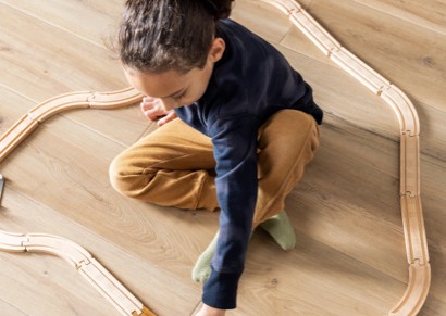 Kid playing on vinyl floor | Carpet Direct Flooring